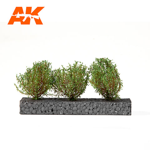 A AK Interactive Dark Green Bushes 4-6 cm priced at $21.99 available from Echelon Hobbies